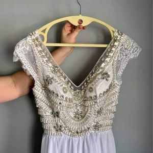 Bohemian style Beaded lace cap sleeve wedding gown.